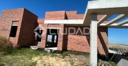 Terreno urbano en Martín Miguel con construcción a terminar