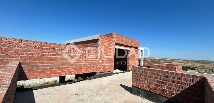 Terreno urbano en Martín Miguel con construcción a terminar