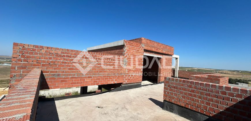 Terreno urbano en Martín Miguel con construcción a terminar