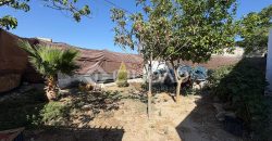 Terreno rústico con construcción e invernaderos